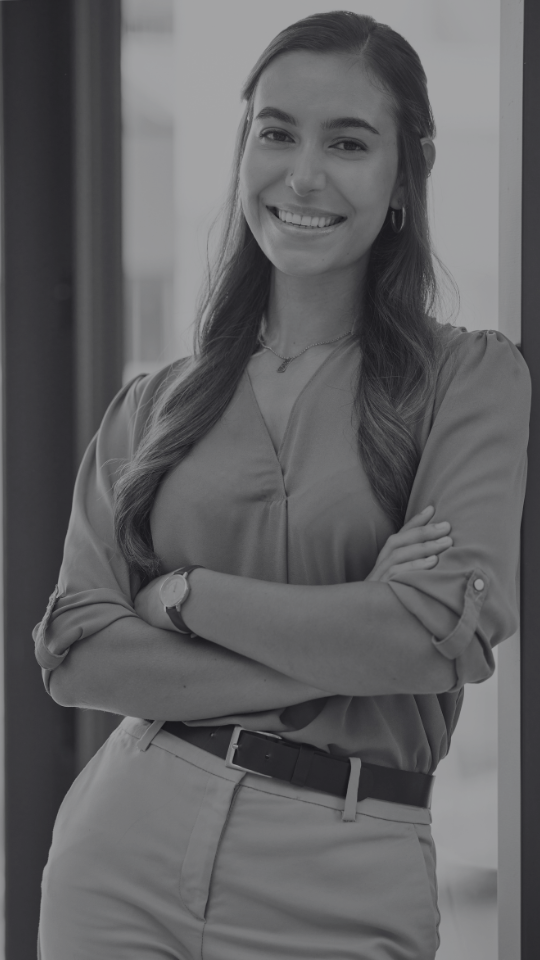 Young corporate woman arms folded and smiling